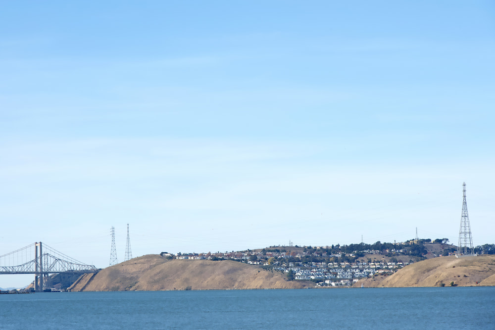 Landscape view of coastal Vallejo, California overlooking the Carquinez straight with the Carquinez bridge connecting to Crocket and the 80 freeway.